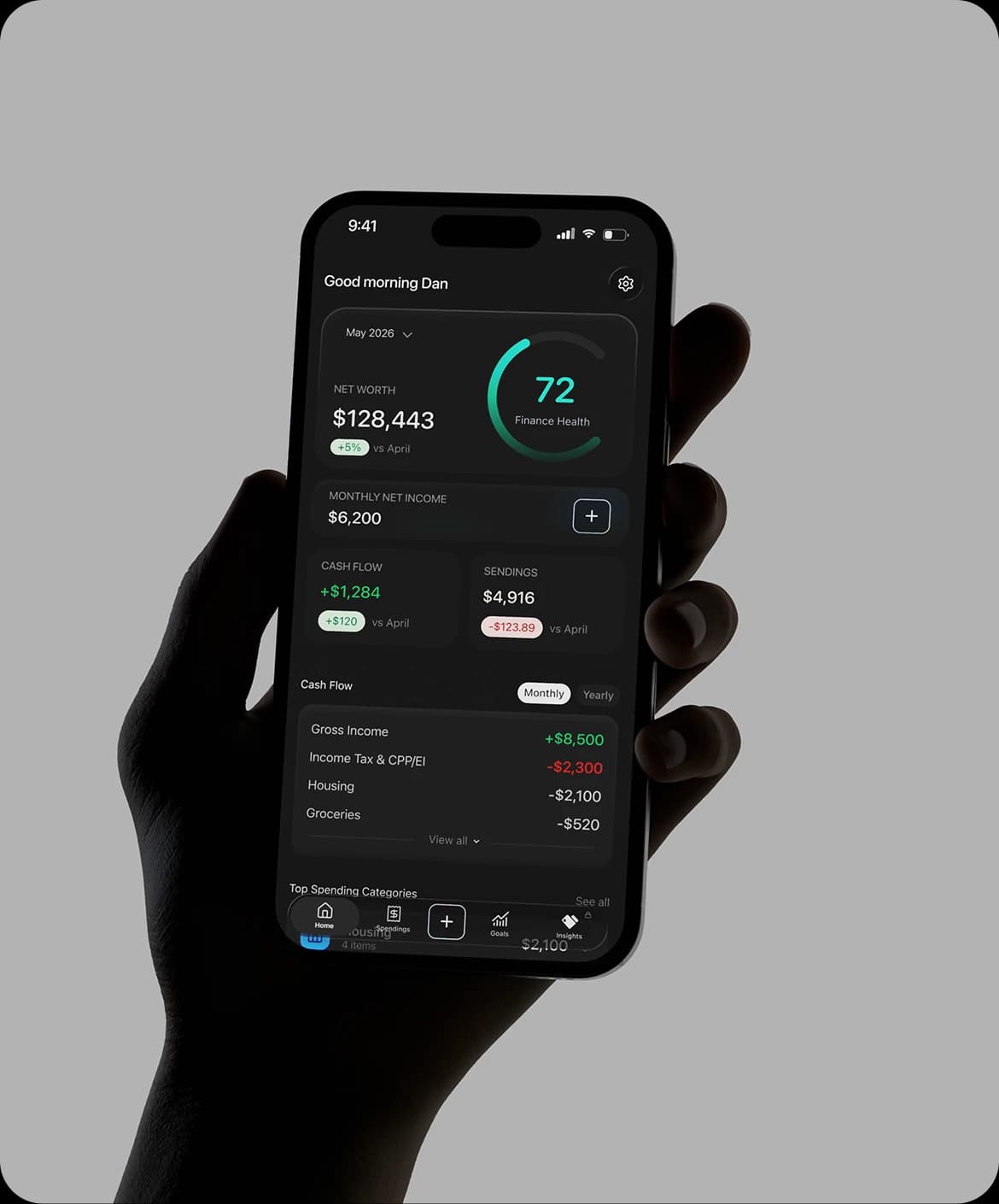 A hand holding a phone showing the OnePay home screen with a Finance Health score of 72